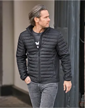 Tee Jays Men's Crossover Jacket | Showerproof Puffer | Softshell Panels | Black or Grey | S-4XL